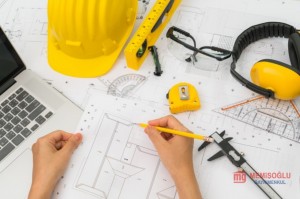 hand_over_construction_plans_with_yellow_helmet_and_drawing_tool_1232_2909 (1).jpg